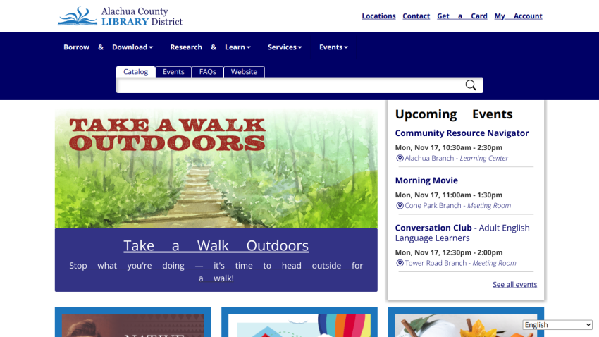 Alachua County Library District homepage with navigation, search bar, hero image promoting outdoor walks, and upcoming events listing.