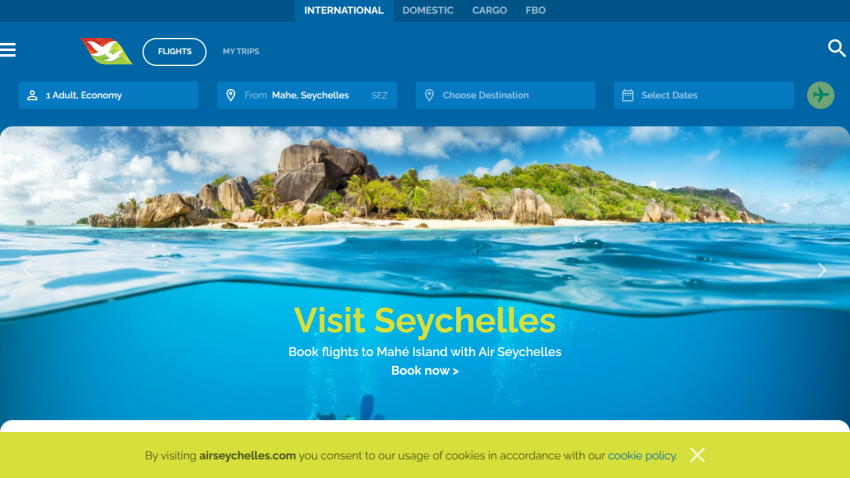Air Seychelles homepage with flight booking options and a scenic Seychelles island and ocean background