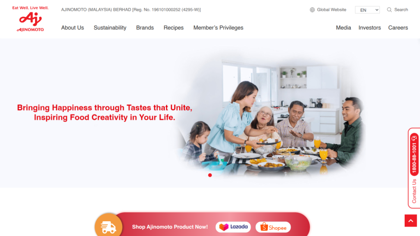 Ajinomoto Malaysia website with navigation links and a hero image of a family enjoying a meal, promoting food creativity and happiness