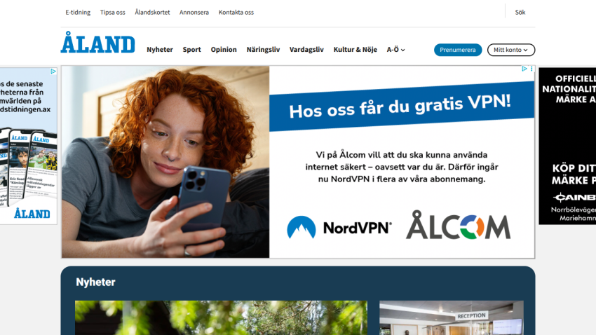 Åland news website with navigation menu, container rental ad, and news section featuring nature and reception images.