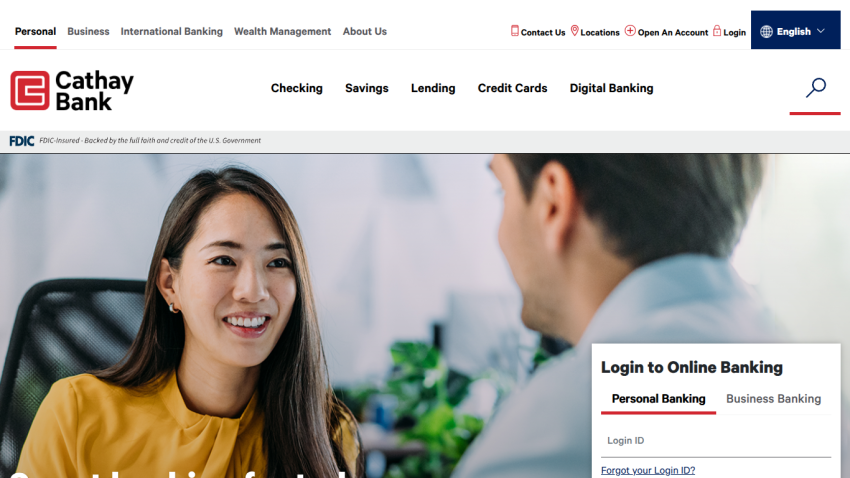Cathay Bank homepage with navigation menu, hero image of two people talking, and online banking login form