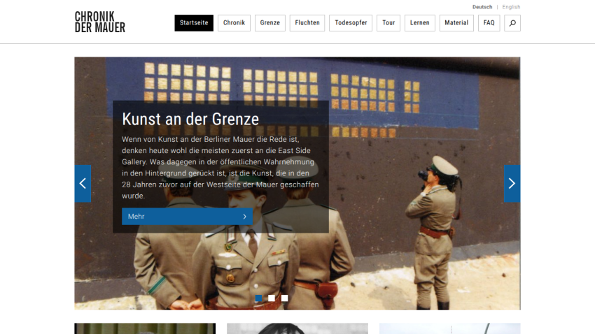 Website about the Berlin Wall featuring a hero image of border guards and text on art at the border with navigation menu