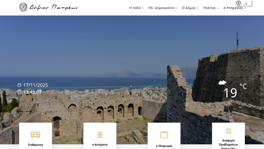 Municipality website with navigation menu, weather info, date and time, and service icons over a coastal fortress background