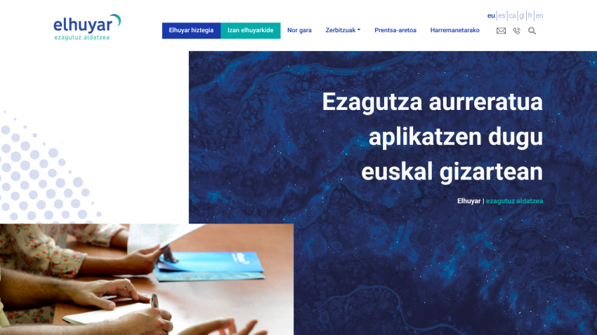 Homepage featuring a blue background with text about applications in Basque society.