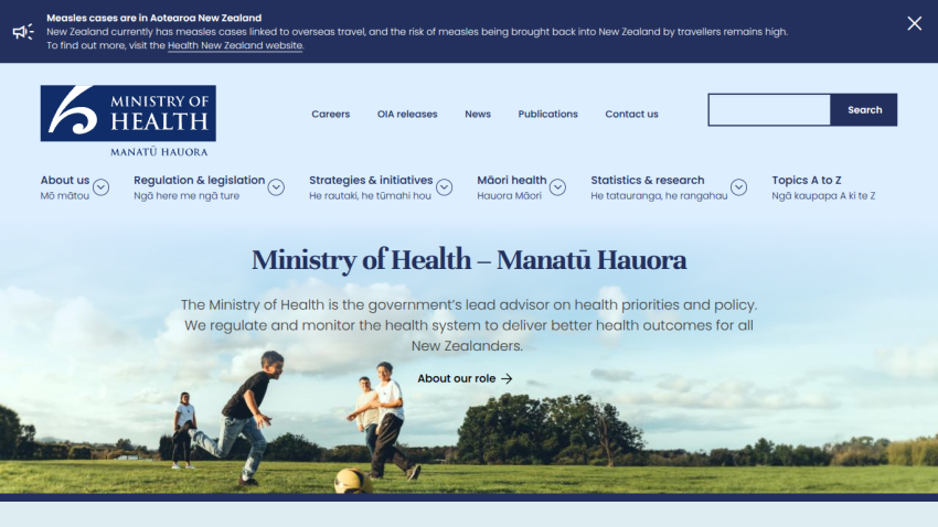 Ministry of Health New Zealand homepage with navigation links and a hero image of children playing soccer outdoors