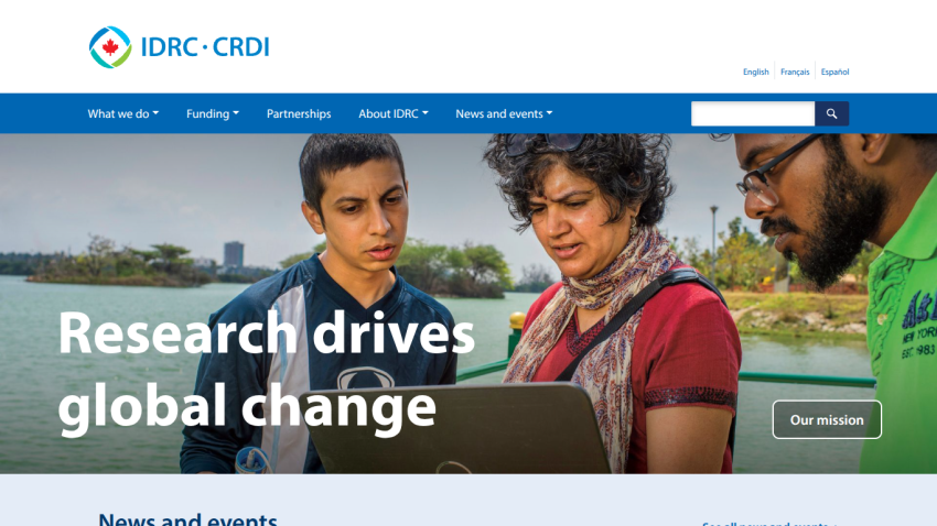 IDRC CRDI website homepage with headline 'Research drives global change' and two people looking at a laptop outdoors