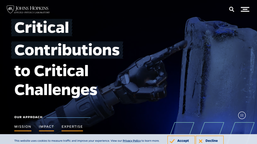 Homepage featuring a robotic hand pointing at ice, with the title 'Critical Contributions to Critical Challenges'.