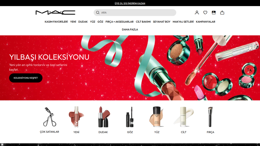 MAC Cosmetics website showing the New Year collection with red background, ribbon, and makeup products