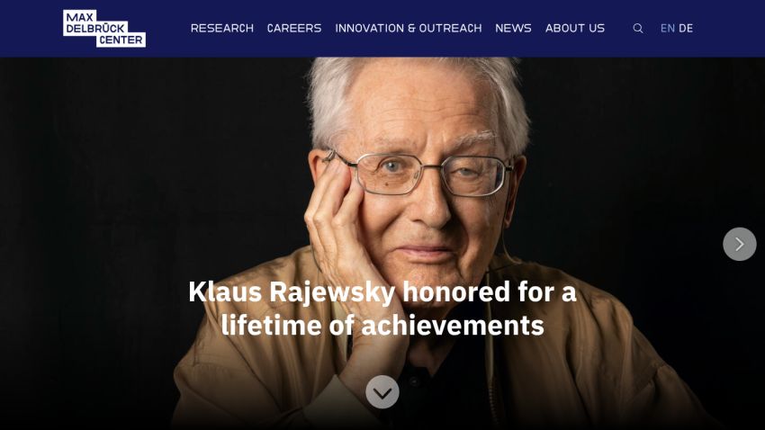 Homepage featuring Klaus Rajewsky honored for achievements with navigation links.