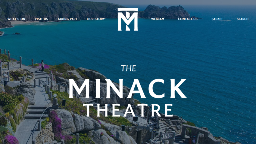 The Minack Theatre website header with navigation menu over a coastal cliffside background