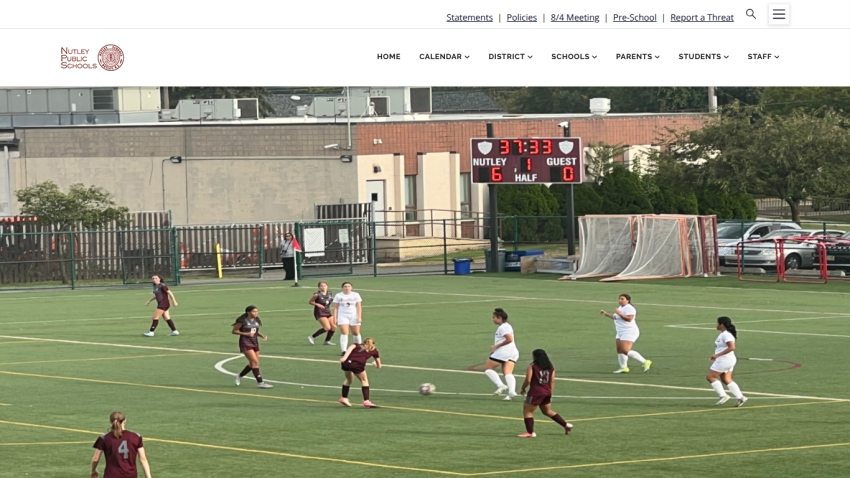 Nutley Public Schools website with navigation menu and hero image of a girls' soccer game showing Nutley leading 6-0