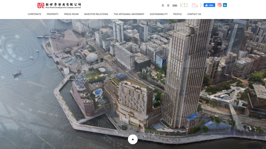New World Development Company Limited website with navigation menu and aerial view of waterfront cityscape and buildings