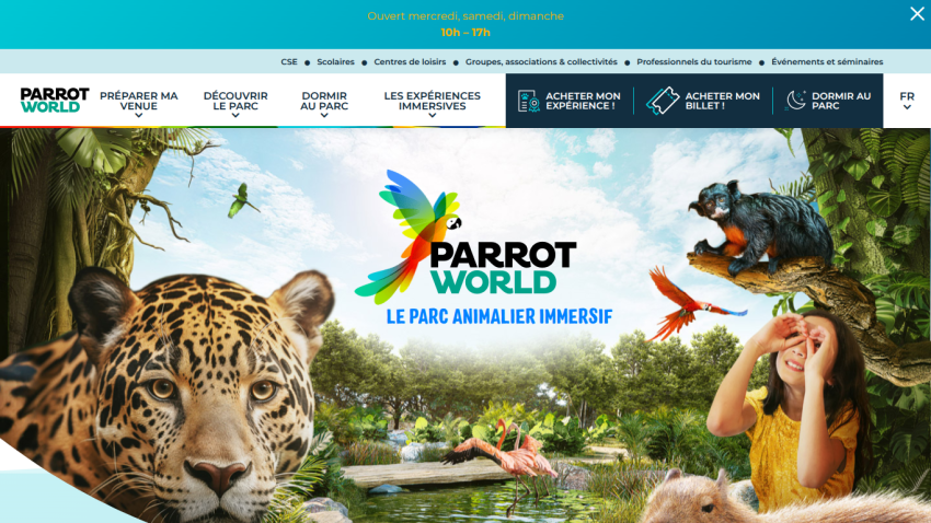 Parrot World immersive animal park homepage with navigation menu, logo, and vibrant animal and nature scene