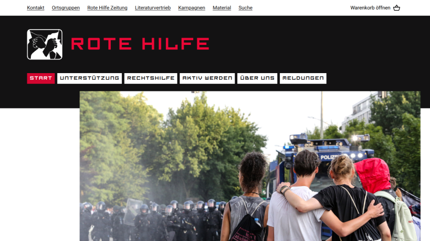 Rote Hilfe website with navigation menu and hero image of people embracing facing police officers and vehicle