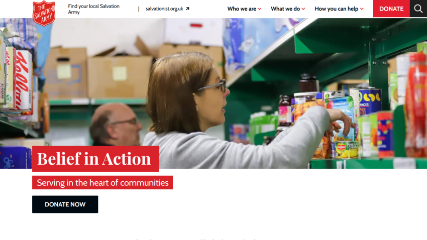 Belief in Action headline with a person organizing items on a shelf; donation button visible.