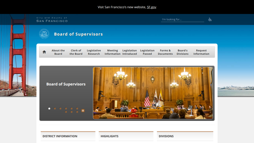 San Francisco Board of Supervisors website with navigation menu and hero image of a meeting in a wood-paneled chamber