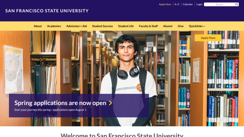 Spring applications are now open at San Francisco State University, featuring a student in a library.