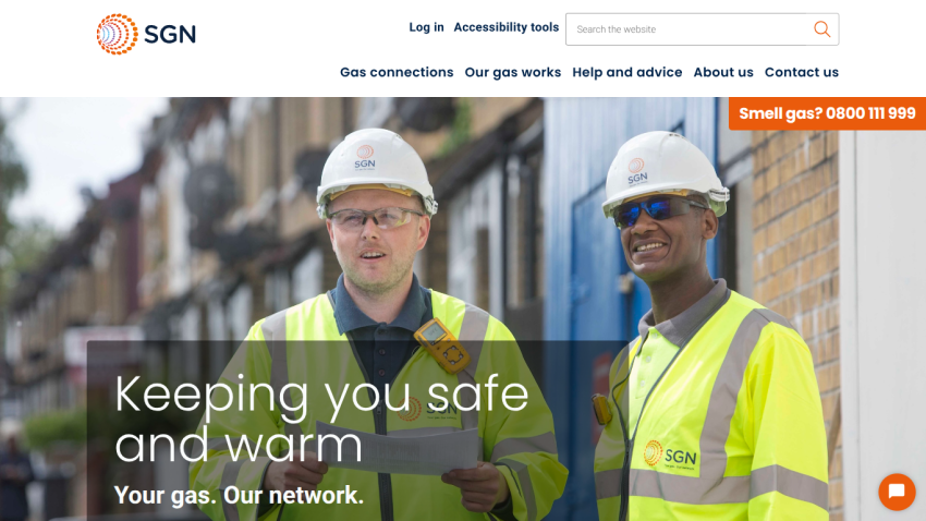 Gas network company homepage with workers in safety gear and text 'Keeping you safe and warm, Your gas. Our network.'