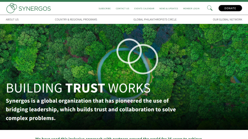 Homepage with navigation bar, large hero image of a mountain landscape, headline 'Explore the World', and a call-to-action button