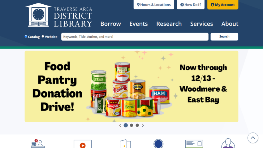 Traverse Area District Library homepage with navigation, search bar, and a food pantry donation drive announcement