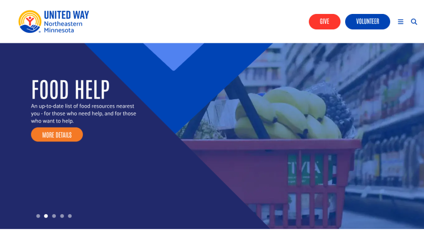 Homepage with navigation bar, large hero image of a mountain landscape, and headline 'Explore the World with Us'