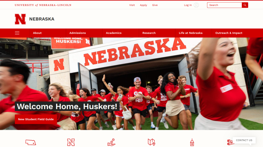 University of Nebraska homepage featuring students welcoming newcomers with a banner saying 'Welcome Home, Huskers!'
