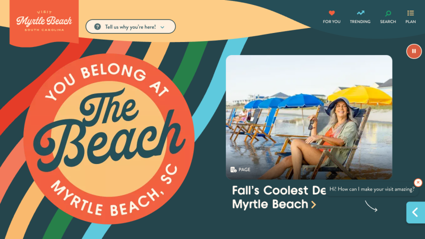Myrtle Beach promotional banner with text 'You Belong at The Beach' and a woman on the beach.