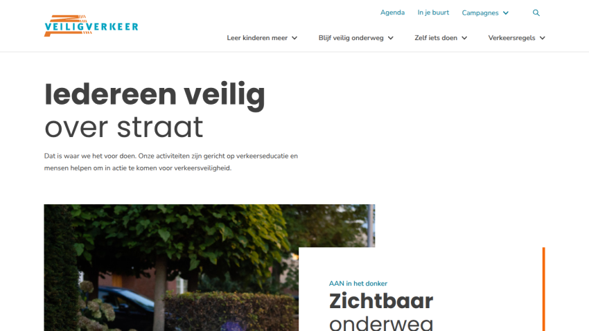 Website promoting traffic safety education with headline 'Iedereen veilig over straat' and a section about visibility in the dark.
