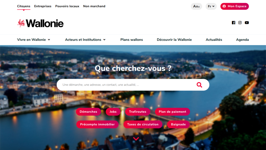 Homepage of Wallonie featuring a search bar and scenic river view.