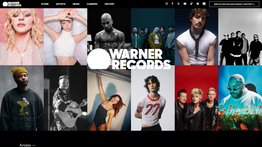 Warner Records homepage featuring a grid of artist photos and navigation menu with store, artists, news, careers, and history