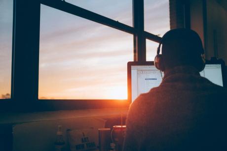 man-sitting-facing-monitor