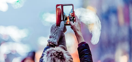 Girl clicking the picture of a bird