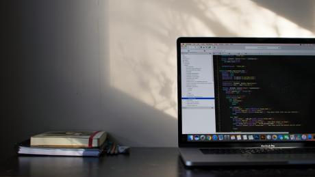 An open laptop with code running