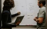 two people working together