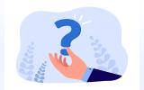 Business man's hand holding a question mark